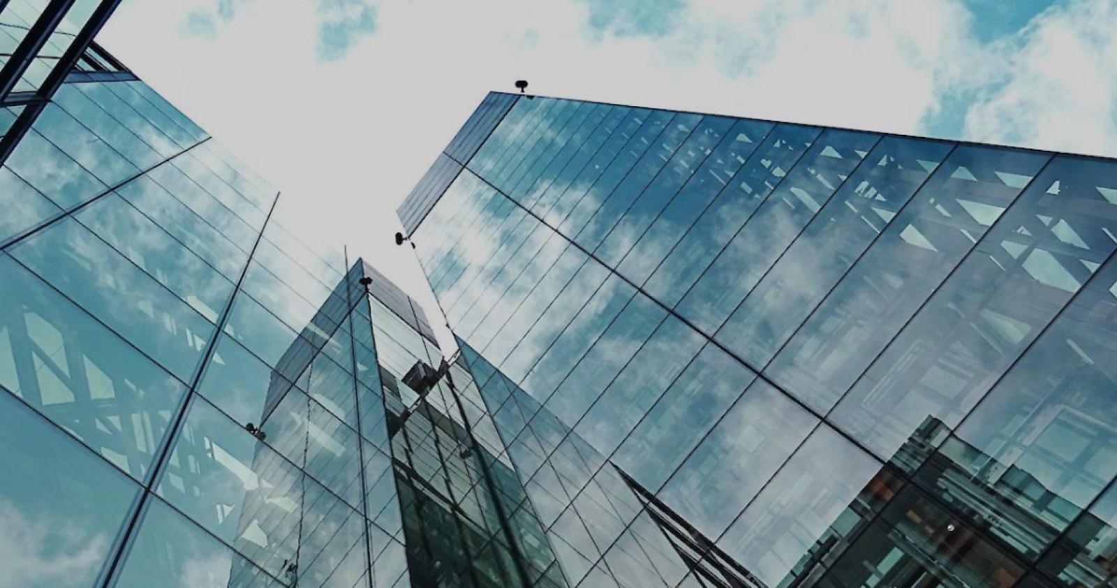 Glass tower facade against the sky