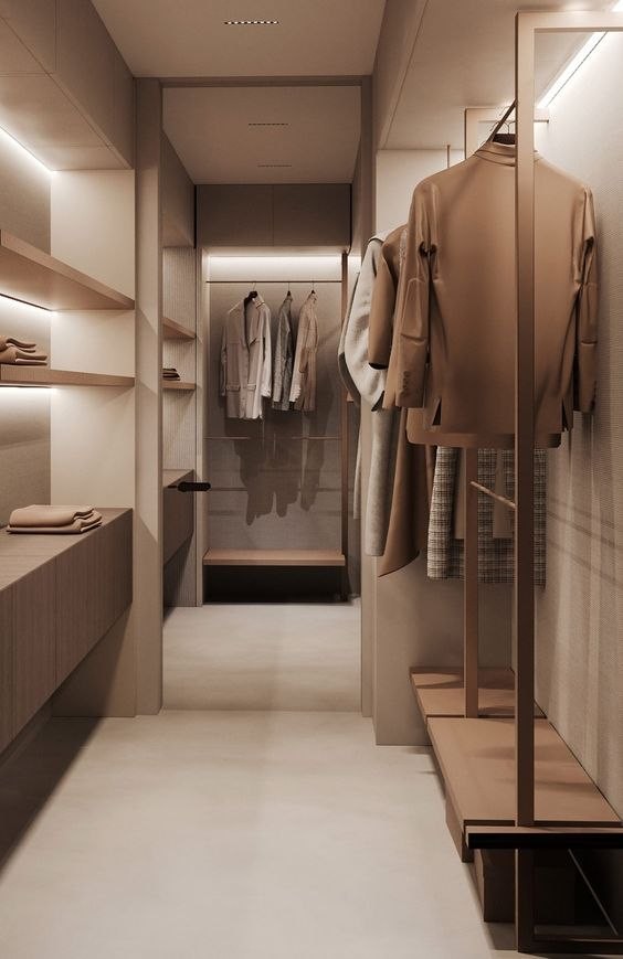 Lit walk-in wardrobe with open shelving